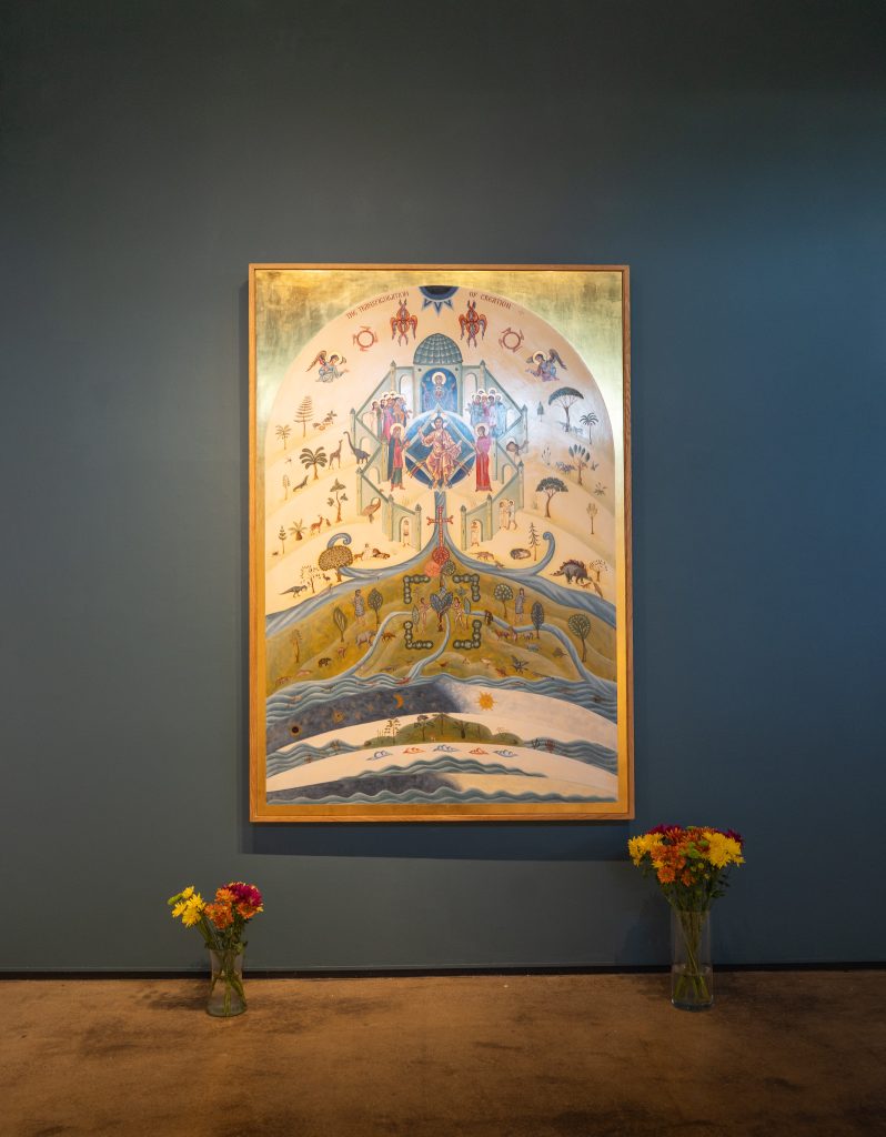 The photo shows a painting depicting images of creation.