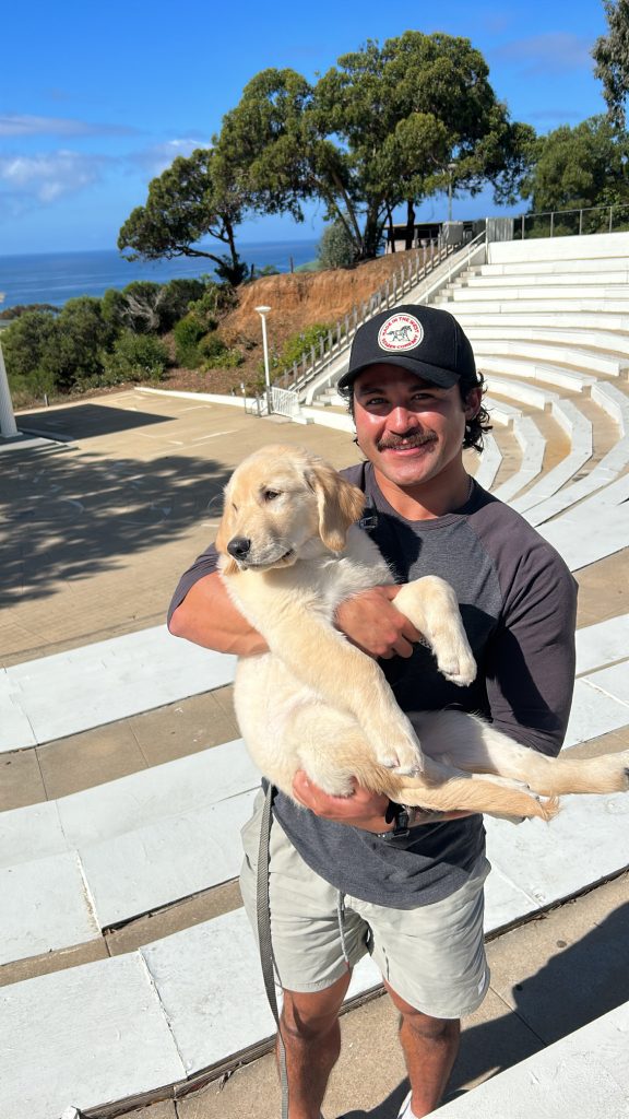 a man holding his dog