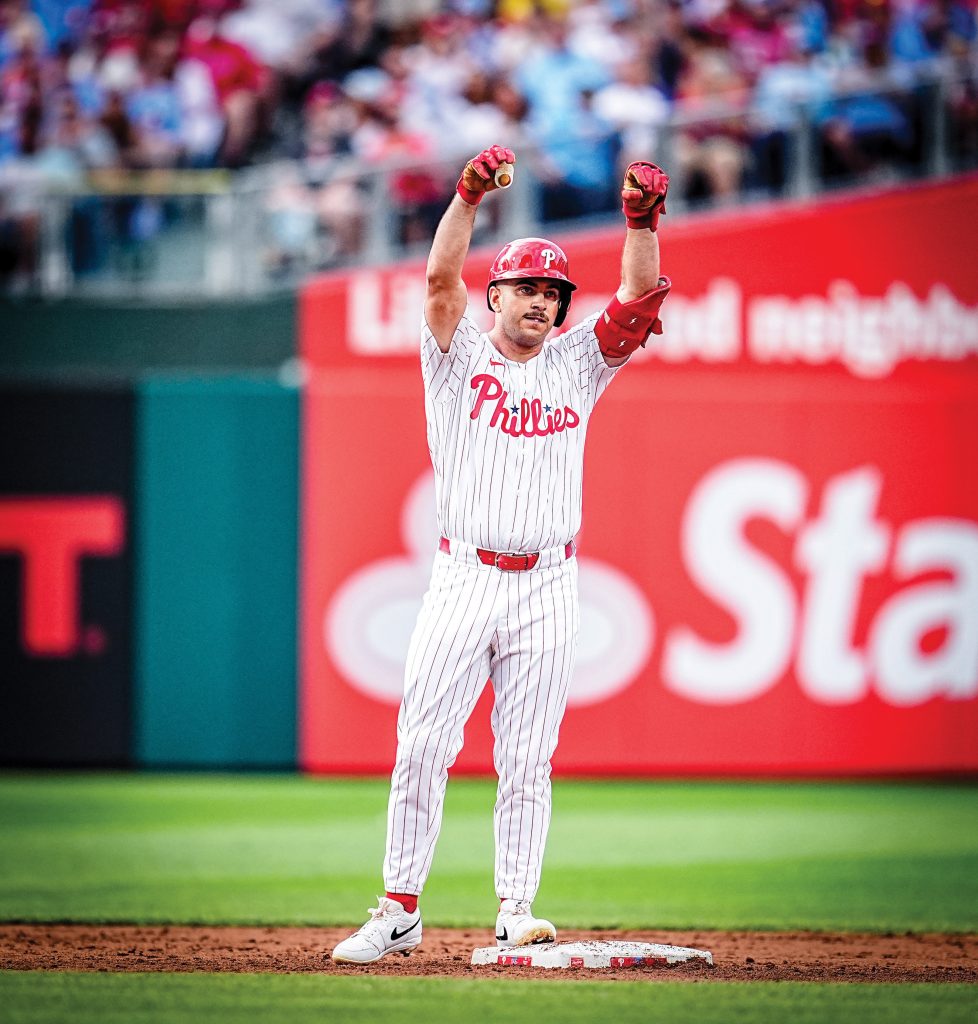Otto on the baseball mound in his Phillies jersey.