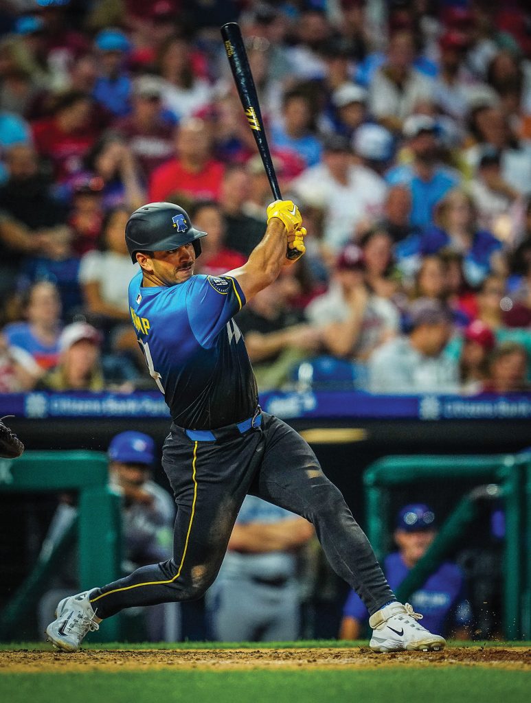 Otto swinging the bat mid-game.