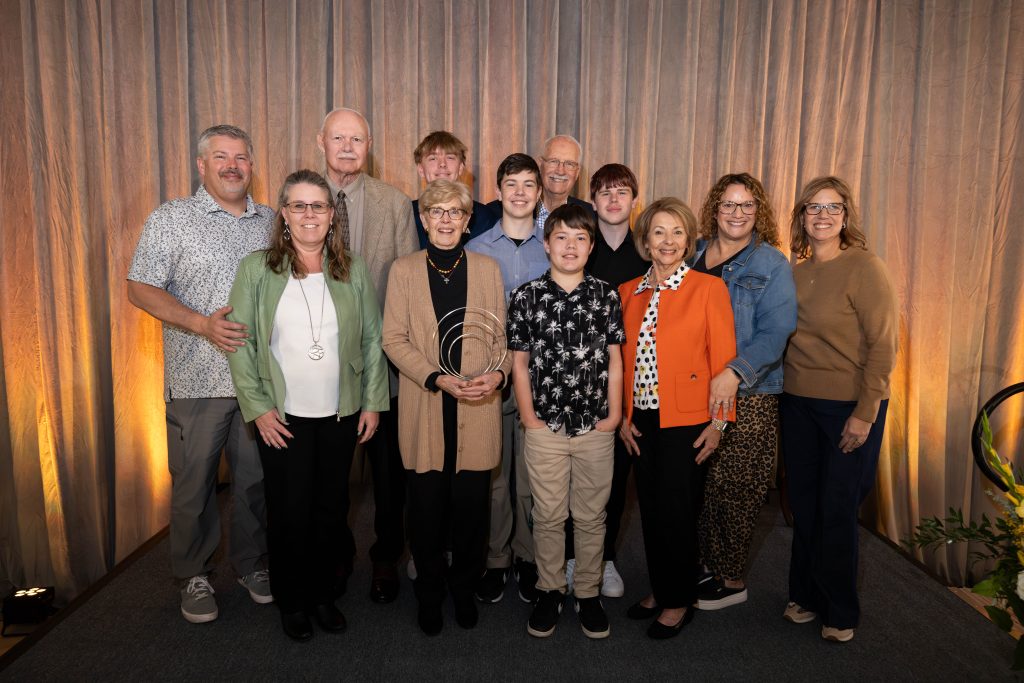 Sandra Foster's family gathers for a photo during the Homecoming awardee ceremony. 
