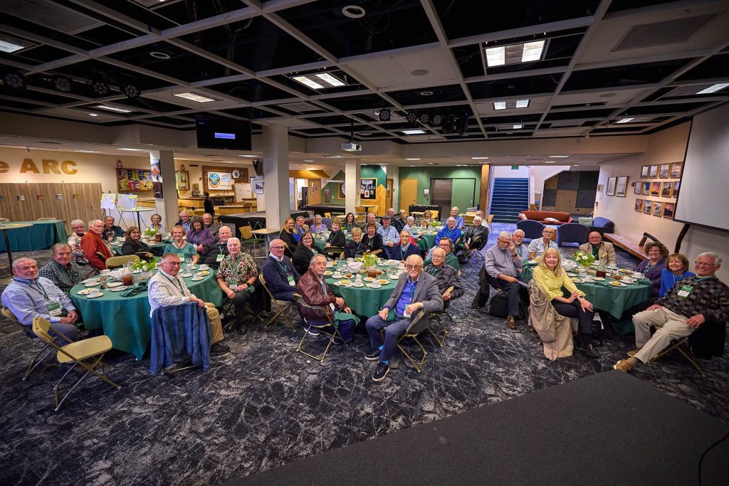 A PLNU reunion groups sits in many circle tables within the ARC.