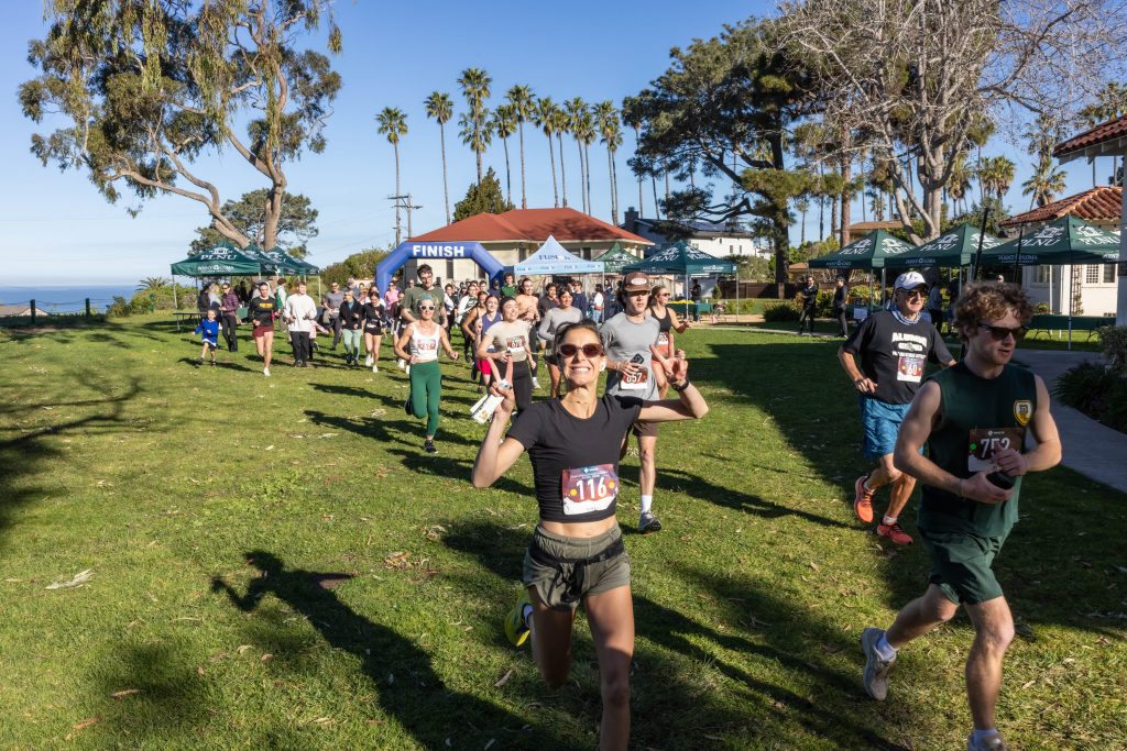 Runners start the PLNU Homecoming 5K race.