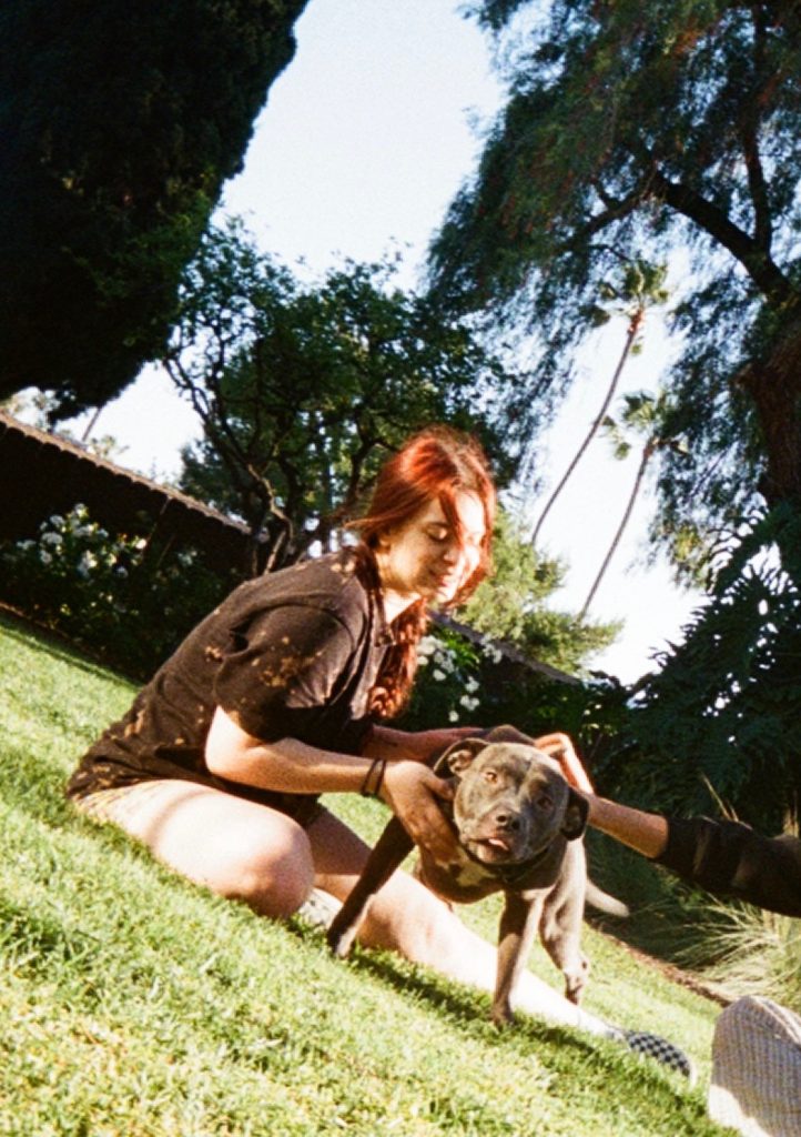 A PLNU student with her dog.
