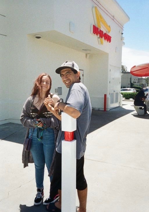 A PLNU student and a friend in front of In-N-Out.