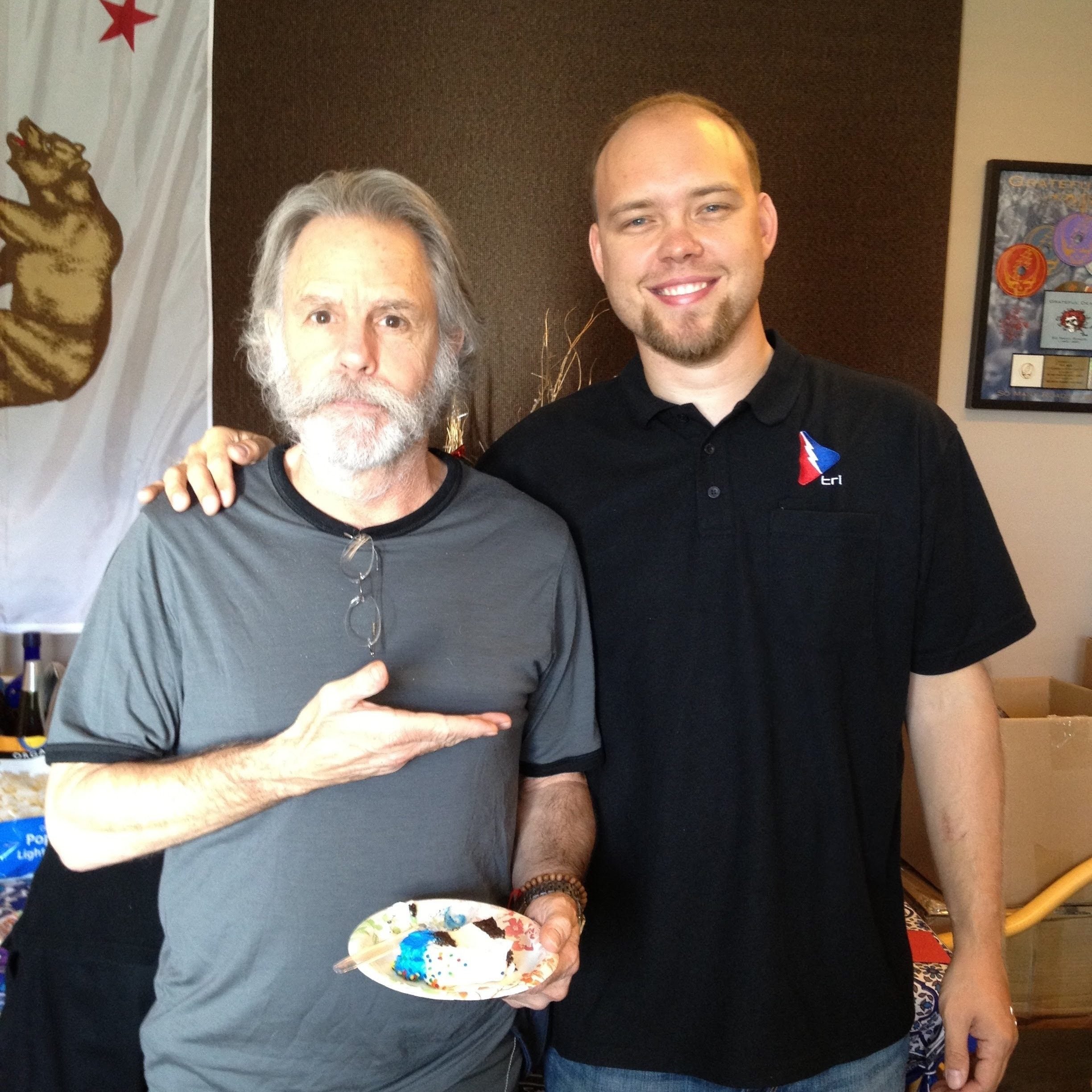 Heitman standing with Bob Weir.