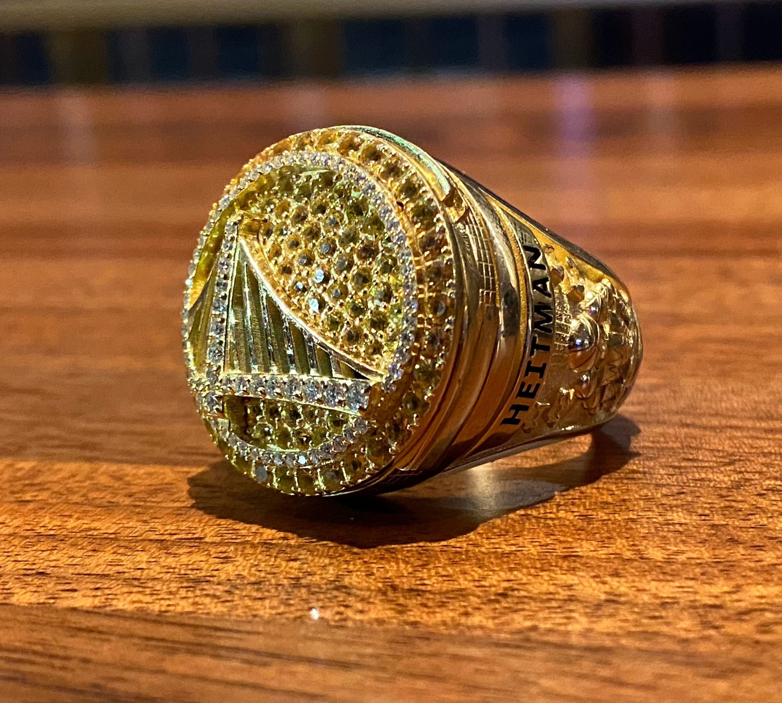 A closeup photo of the Golden State Warriors' gold championship ring. 